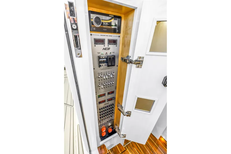 Best Deal Yacht Photos Pics Electrical control panel inside 2023 HCB 53 Suenos RXV boat, featuring advanced navigation systems.