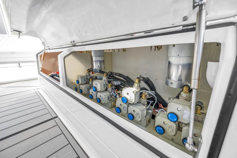 Best Deal Yacht Photos Pics 2023 HCB 53 Suenos RXV engine compartment with mechanical components and wiring.