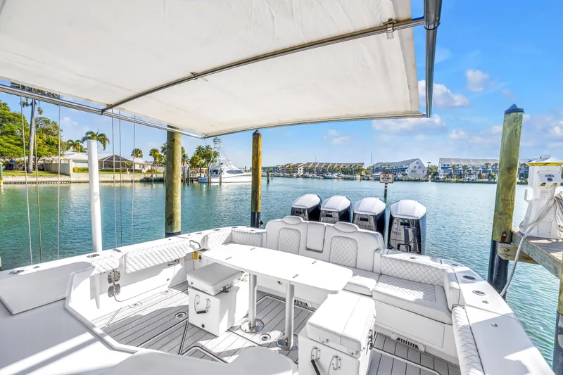 Best Deal Yacht Photos Pics 2023 HCB 53 Suenos RXV luxury boat interior with seating and outboard motors.