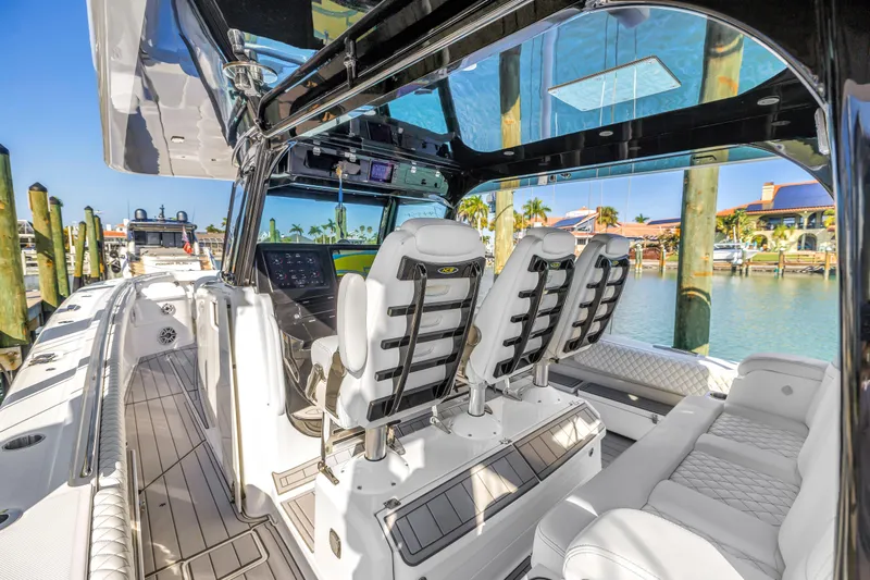 Best Deal Yacht Photos Pics Luxurious 2023 HCB 53 Suenos RXV boat interior with plush seating and modern dashboard.