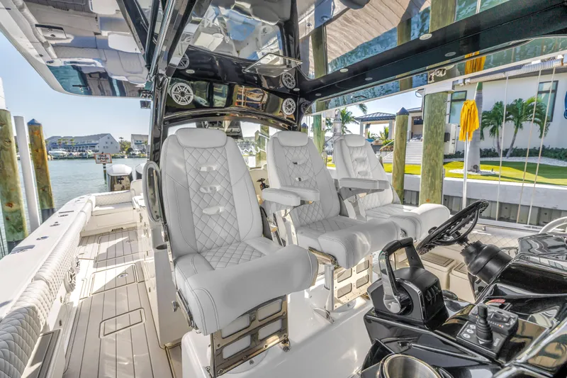 Best Deal Yacht Photos Pics 2023 HCB 53 Suenos RXV boat interior with luxurious seating and modern controls.