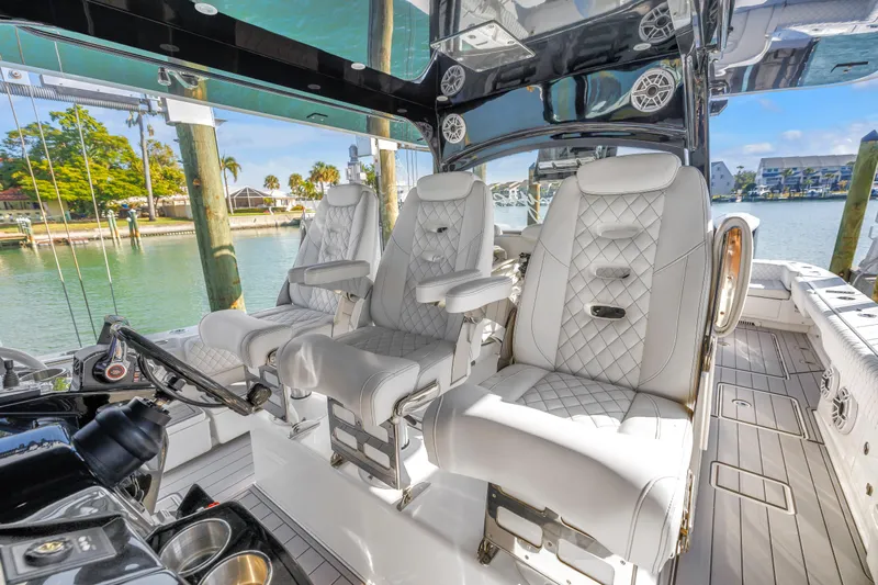 Best Deal Yacht Photos Pics Luxurious interior of 2023 HCB 53 Suenos RXV boat with plush seating and modern design.