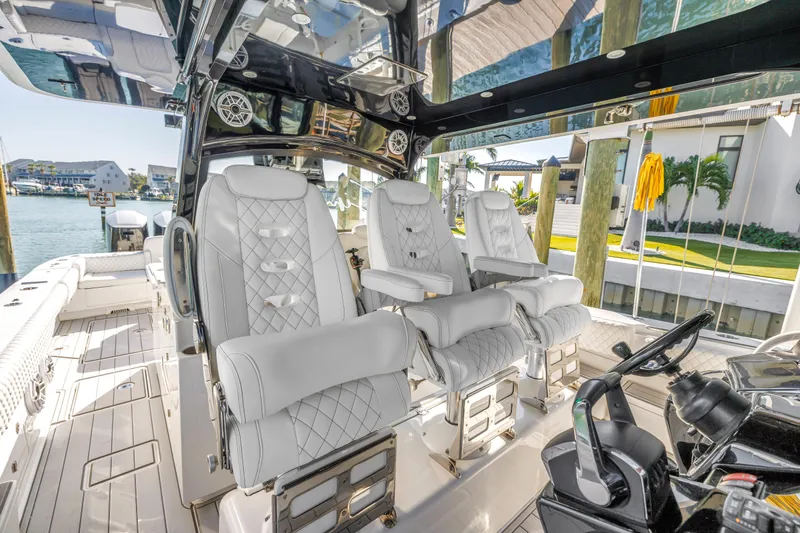 Best Deal Yacht Photos Pics Luxurious interior of 2023 HCB 53 Suenos RXV boat with plush seating and modern design.