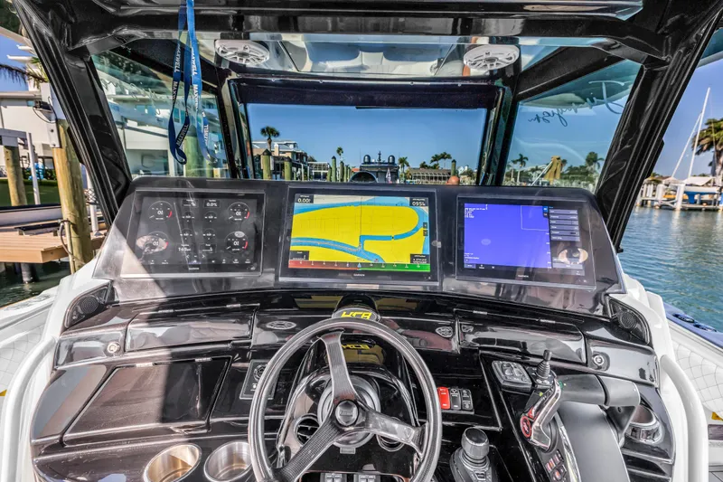 Best Deal Yacht Photos Pics 2023 HCB 53 Suenos RXV boat dashboard with advanced navigation screens and controls.