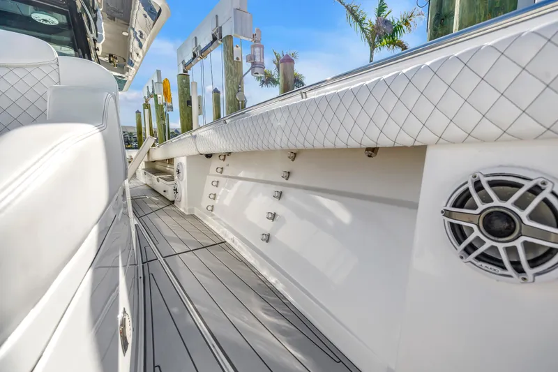Best Deal Yacht Photos Pics 2023 HCB 53 Suenos RXV boat interior with sleek white seating and speaker detail.