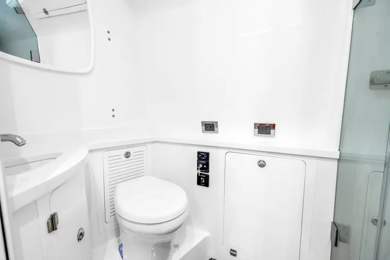 Best Deal Yacht Photos Pics 2023 HCB 53 Suenos RXV boat bathroom with modern fixtures and sleek design.