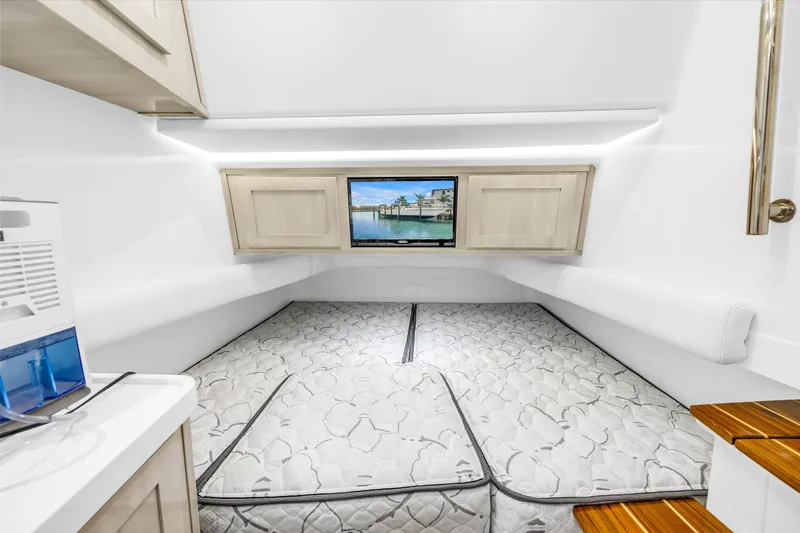 Best Deal Yacht Photos Pics 2023 HCB 53 Suenos RXV cabin interior with bed and TV.