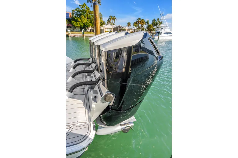 Best Deal Yacht Photos Pics 2023 HCB 53 Suenos RXV boat engines docked in clear water.