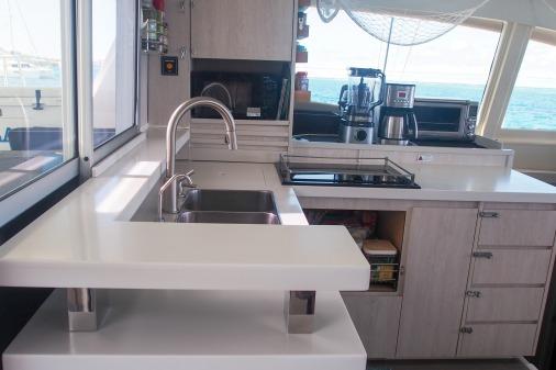 Modern kitchen interior on 2015 Leopard 48 yacht with ocean view.