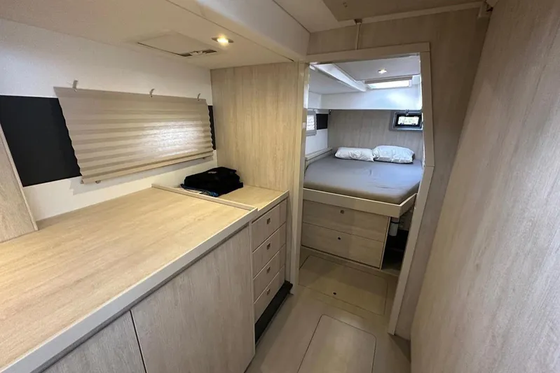 Pilar Yacht Photos Pics 2015 Leopard 48 yacht interior with modern bedroom and storage cabinets.