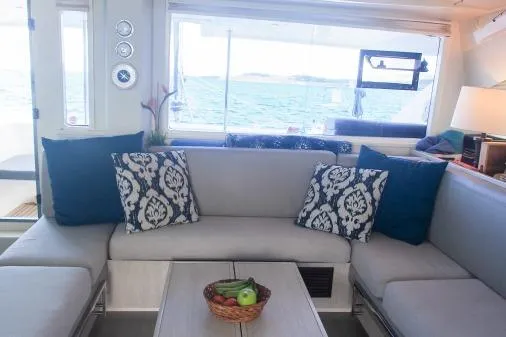 Pilar Yacht Photos Pics Interior of 2015 Robertson & Caine Leopard 48 yacht with stylish seating and ocean view.