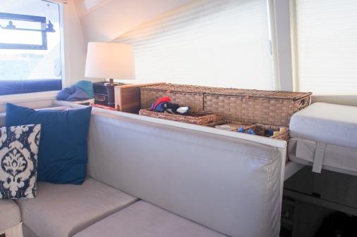 Interior of 2015 Robertson & Caine Leopard 48 yacht with cozy seating and decorative pillows.