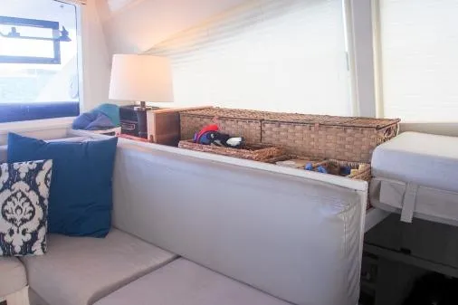 Pilar Yacht Photos Pics Interior of 2015 Robertson & Caine Leopard 48 yacht with cozy seating and decorative pillows.