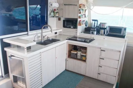 Pilar Yacht Photos Pics 2015 Robertson & Caine Leopard 48 yacht kitchen with modern appliances and sleek design.