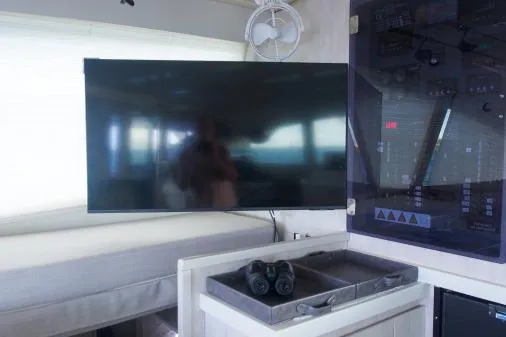 Pilar Yacht Photos Pics Interior of 2015 Robertson & Caine Leopard 48 yacht with TV and navigation panel.