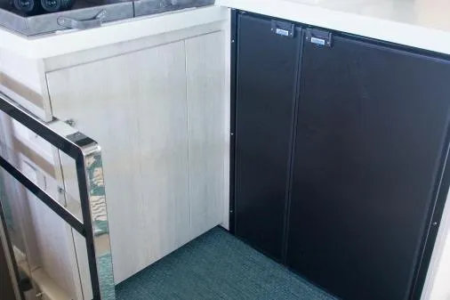 Pilar Yacht Photos Pics 2015 Robertson & Caine Leopard 48 yacht interior kitchen cabinetry and appliances.