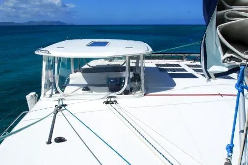Pilar Yacht Photos Pics 2015 Robertson & Caine Leopard 48 catamaran sailing on clear blue ocean.