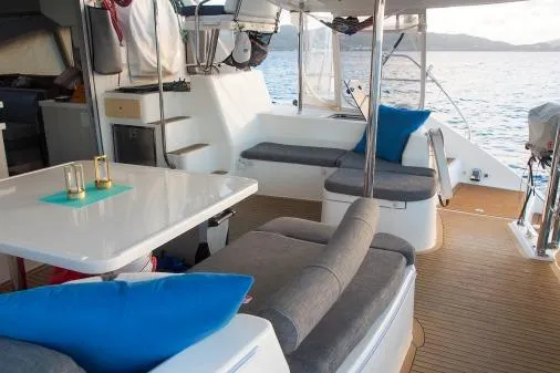 Pilar Yacht Photos Pics 2015 Robertson & Caine Leopard 48 yacht interior with seating and dining area.