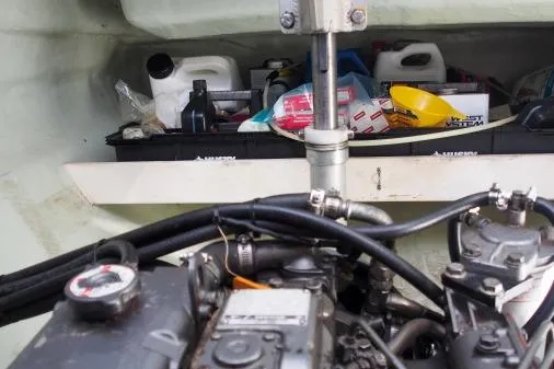 Pilar Yacht Photos Pics Engine compartment of a 2015 Robertson & Caine Leopard 48 with maintenance supplies.