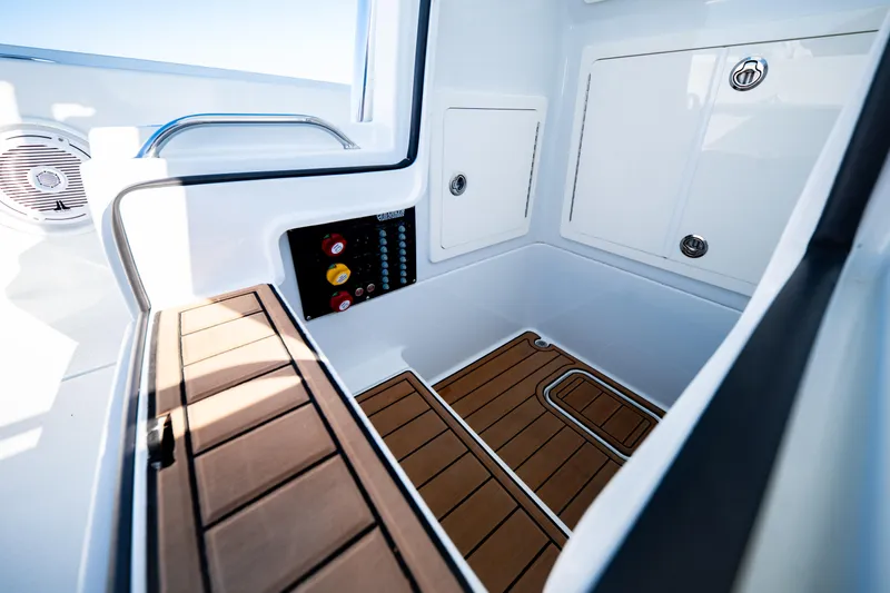  Yacht Photos Pics 2016 Barker Boatworks 26 Calibogue Bay interior with teak flooring and storage compartments.