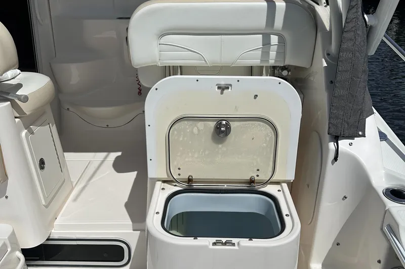 Last One II Yacht Photos Pics Open storage compartment on 2015 Wellcraft 290 Coastal boat interior.