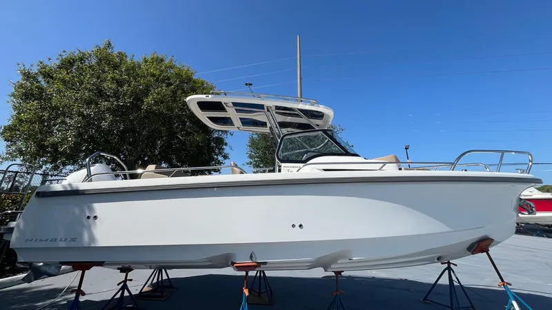 In-stock 2024 Nimbus T8 #314 Yacht Photos Pics 2024 Nimbus Tender 8 #314 boat on stands under clear blue sky.