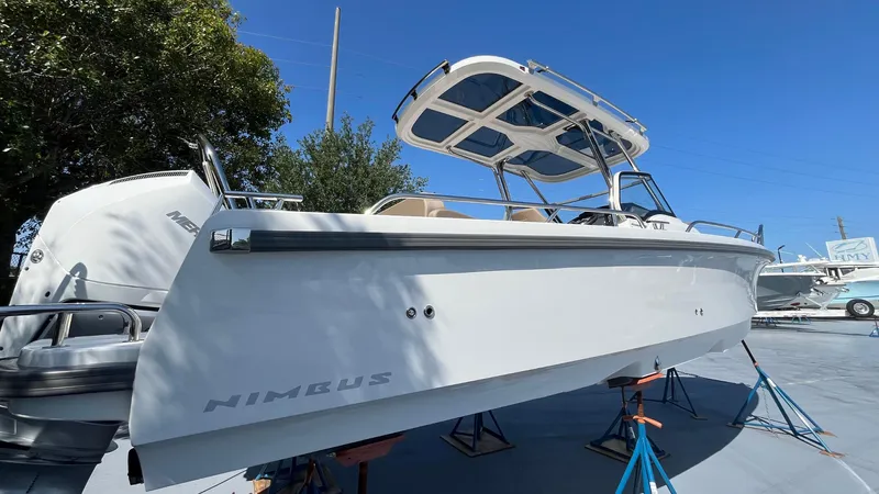 In-stock 2024 Nimbus T8 #314 Yacht Photos Pics 2024 Nimbus Tender 8 #314 boat on stands, white hull, sunny day, clear blue sky.