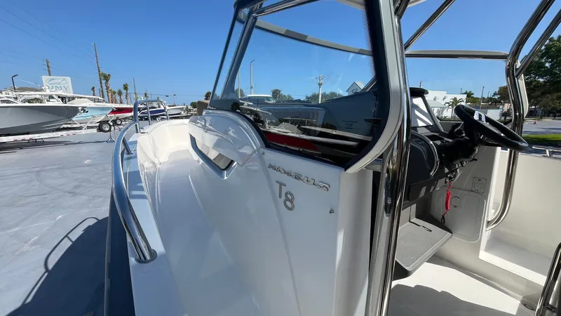 In-stock 2024 Nimbus T8 #314 Yacht Photos Pics 2024 Nimbus Tender 8 #314 boat, sleek design, docked under clear blue sky.