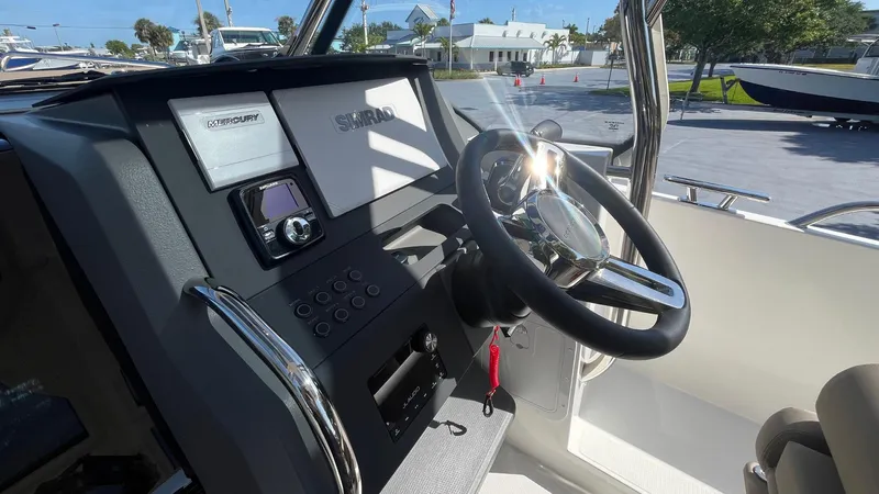 In-stock 2024 Nimbus T8 #314 Yacht Photos Pics 2024 Nimbus Tender 8 #314 boat dashboard with steering wheel and control panel.