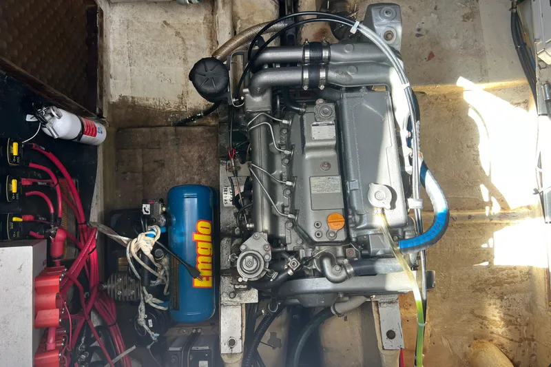 Hobo Tiempo Yacht Photos Pics Engine compartment of a 1986 Amel Mango sailboat with visible components and wiring.