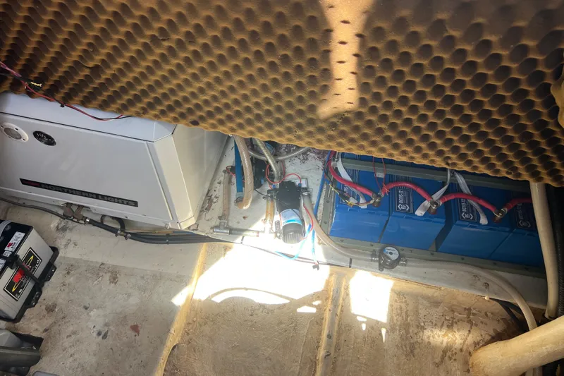 Hobo Tiempo Yacht Photos Pics Engine room of 1986 Amel Mango sailboat with batteries and generator.