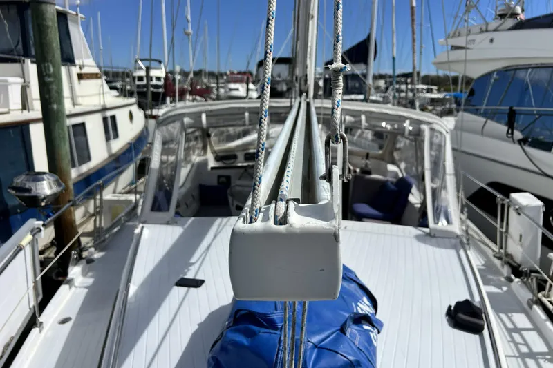 Hobo Tiempo Yacht Photos Pics Sailboat deck view of 1986 Amel Mango in marina, surrounded by other boats.