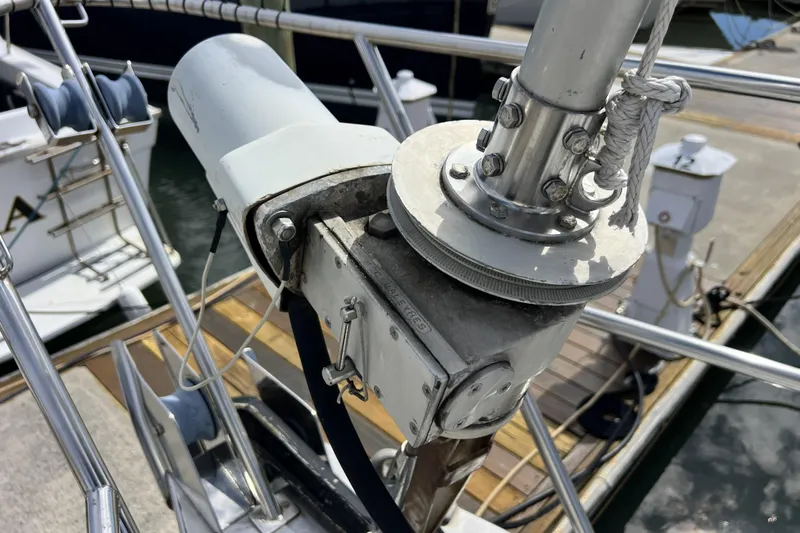Hobo Tiempo Yacht Photos Pics Close-up of a 1986 Amel Mango sailboat's rigging and winch system at a marina.