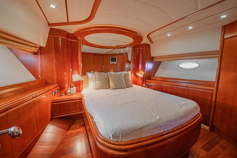 Isabella K Yacht Photos Pics Luxurious cabin interior of 2002 Astondoa 72 GLX yacht with elegant wood finish.