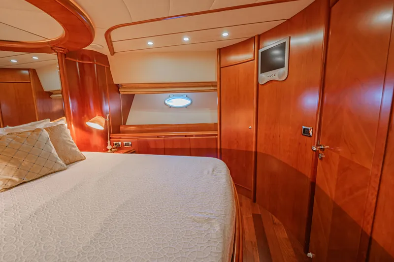 Isabella K Yacht Photos Pics Luxurious cabin interior of 2002 Astondoa 72 GLX yacht with elegant wood finish.