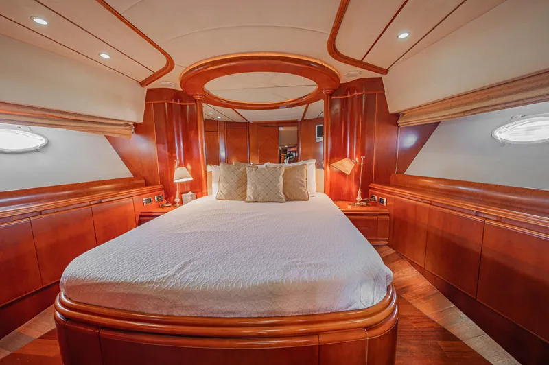 Isabella K Yacht Photos Pics Luxurious cabin interior of 2002 Astondoa 72 GLX yacht with elegant wood finish.