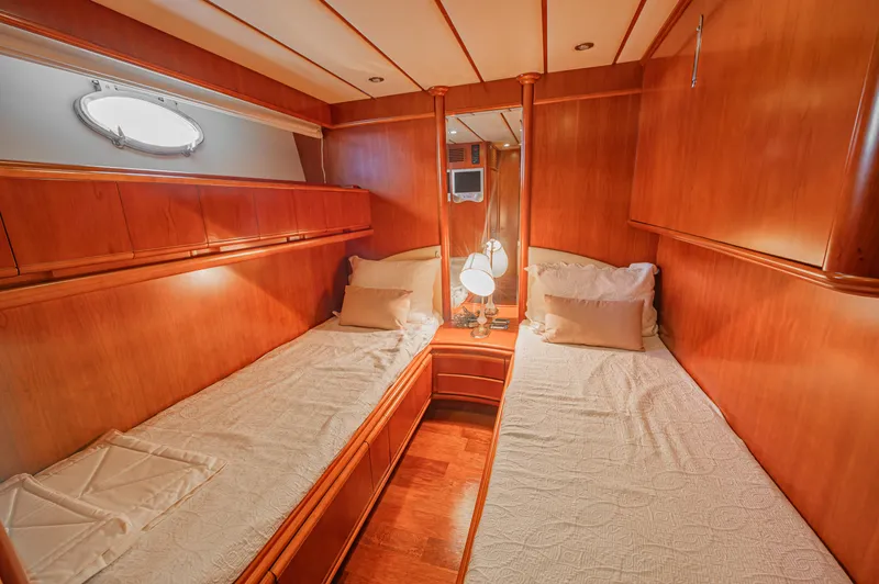 Isabella K Yacht Photos Pics Luxurious twin cabin interior of 2002 Astondoa 72 GLX yacht with wooden finish.