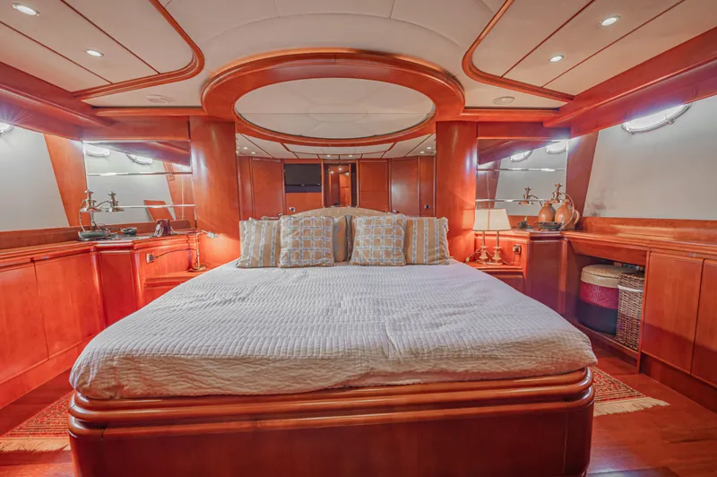 Isabella K Yacht Photos Pics Luxurious cabin interior of 2002 Astondoa 72 GLX yacht with elegant wood finishes.