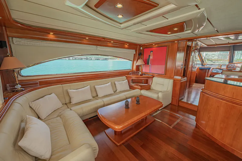 Isabella K Yacht Photos Pics Luxurious interior of 2002 Astondoa 72 GLX yacht with elegant wood finishes and plush seating.