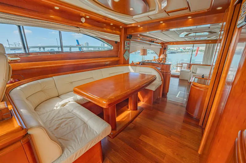 Isabella K Yacht Photos Pics Luxurious interior of 2002 Astondoa 72 GLX yacht with elegant wood finishes and spacious seating.