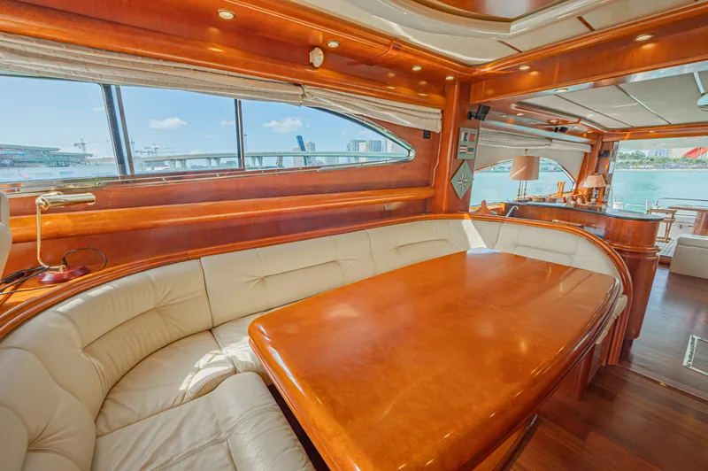 Isabella K Yacht Photos Pics Luxurious interior of 2002 Astondoa 72 GLX yacht with elegant wood and leather seating.