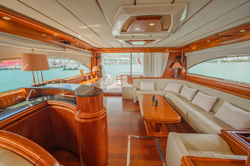 Isabella K Yacht Photos Pics Luxurious interior of 2002 Astondoa 72 GLX yacht with elegant wood and leather furnishings.