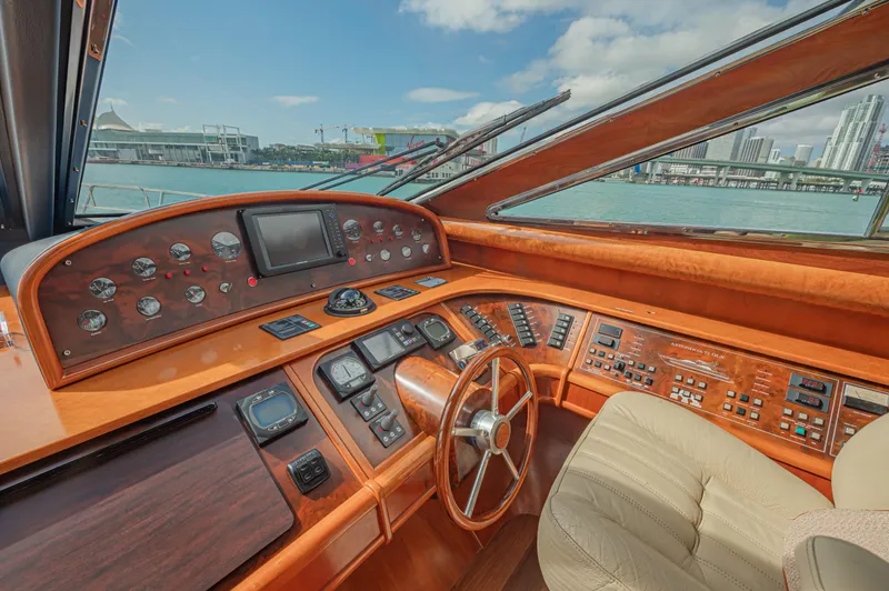 Isabella K Yacht Photos Pics Luxurious 2002 Astondoa 72 GLX yacht helm with city skyline view.