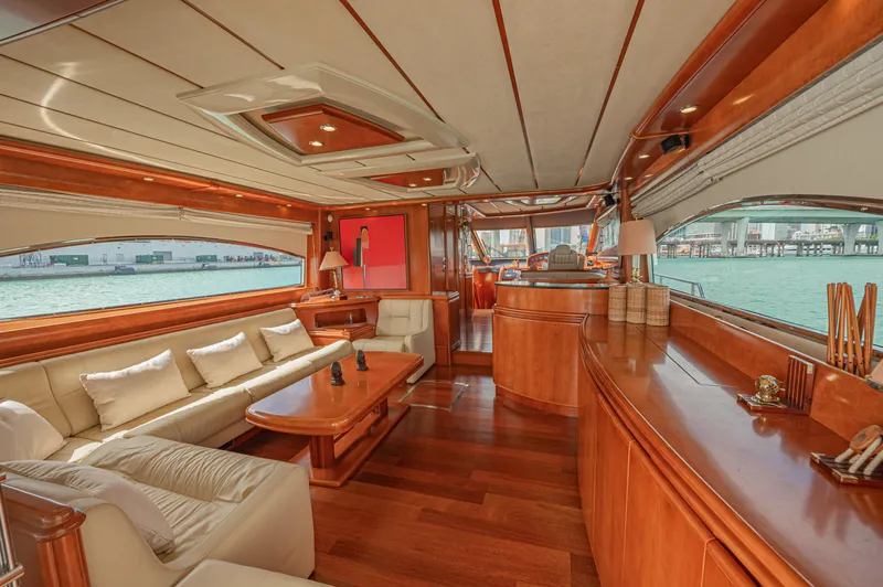 Isabella K Yacht Photos Pics Luxurious interior of 2002 Astondoa 72 GLX yacht with elegant wood finishes and spacious seating.