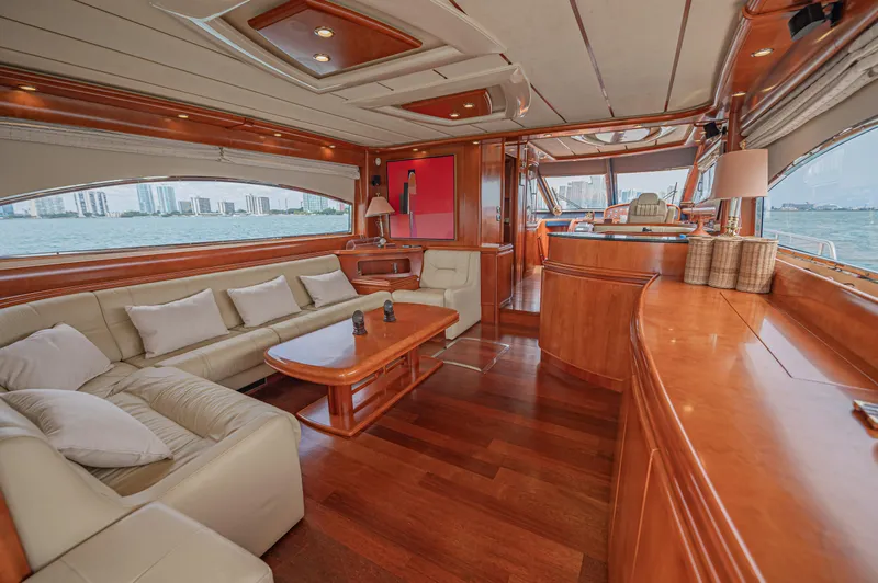 Isabella K Yacht Photos Pics Luxurious interior of 2002 Astondoa 72 GLX yacht with elegant wood finishes and plush seating.