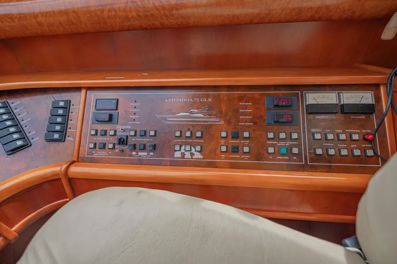 Isabella K Yacht Photos Pics Control panel of a 2002 Astondoa 72 GLX yacht with various switches and gauges.