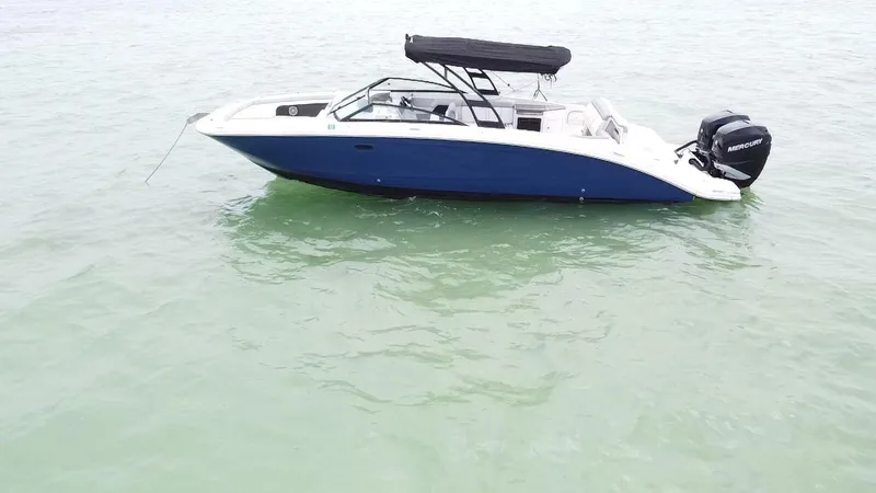  Yacht Photos Pics 2017 Sea Ray SDX 290 Outboard boat on calm water, featuring a sleek design and black canopy.