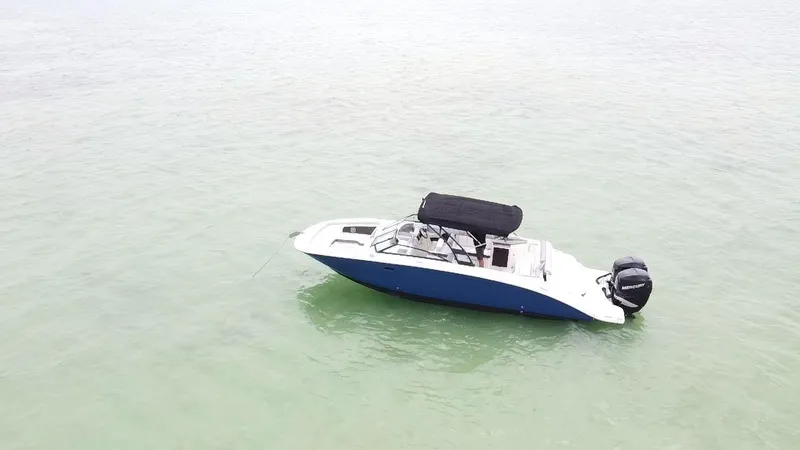  Yacht Photos Pics 2017 Sea Ray SDX 290 Outboard boat on calm water, featuring a sleek design and black canopy.