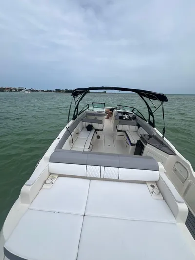  Yacht Photos Pics 2017 Sea Ray SDX 290 Outboard boat on calm water, featuring spacious seating and sleek design.