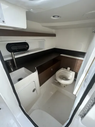  Yacht Photos Pics 2017 Sea Ray SDX 290 Outboard boat interior with sink and toilet.